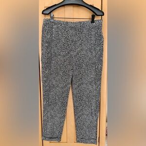 THEORY silk animal print trousers with side pockets and cuffs.